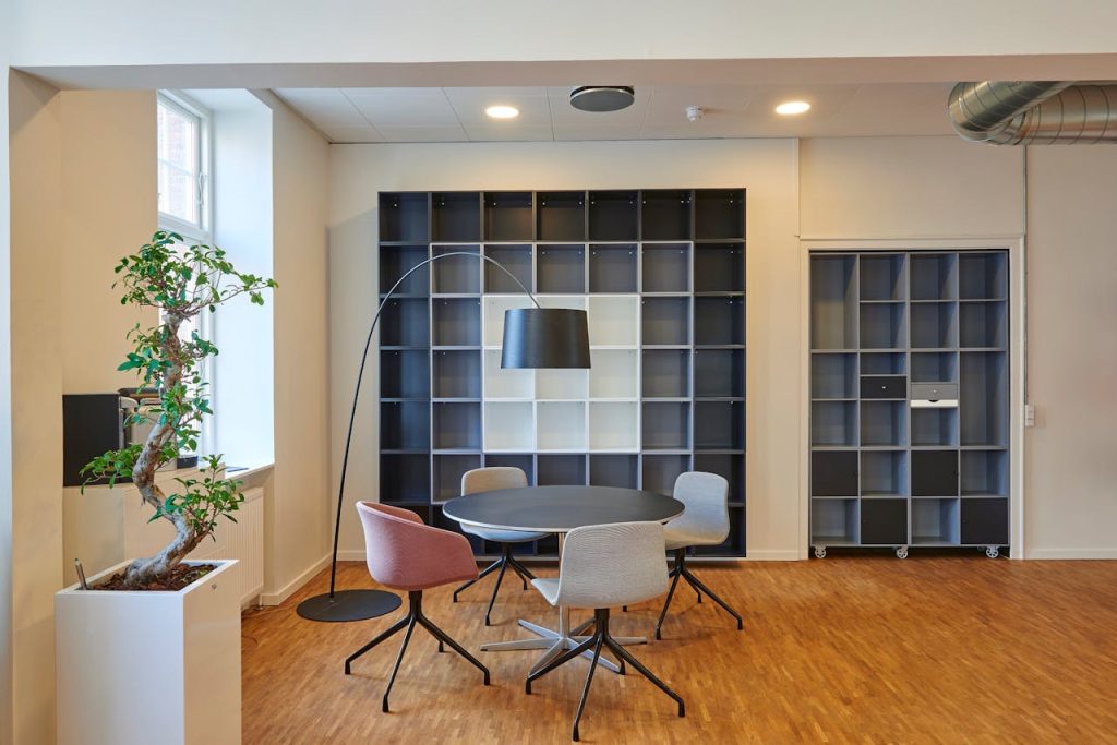 pexels-photo-245240 Bright and stylish office space with contemporary furniture and open shelving.